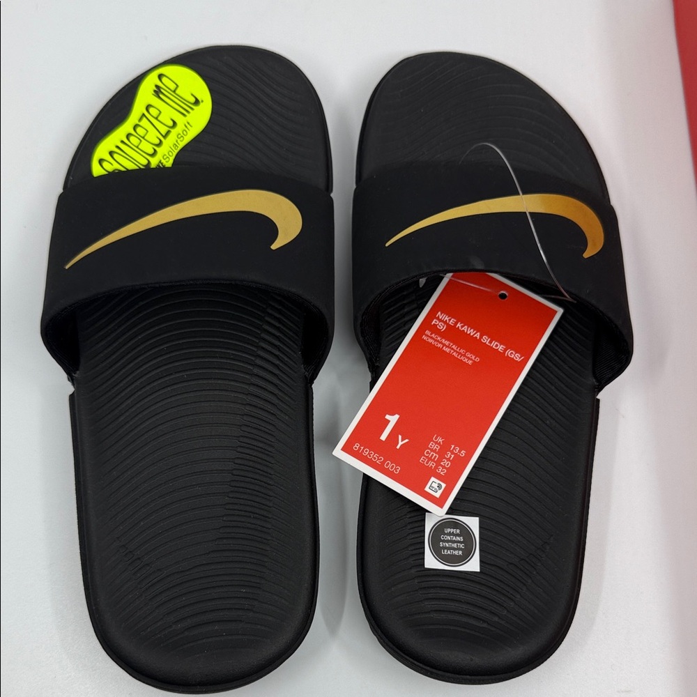Nike Black Slides with Gold Swoosh